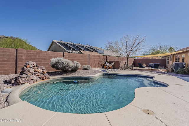 view of swimming pool featuring a patio area, a fenced backyard, and a fenced in pool