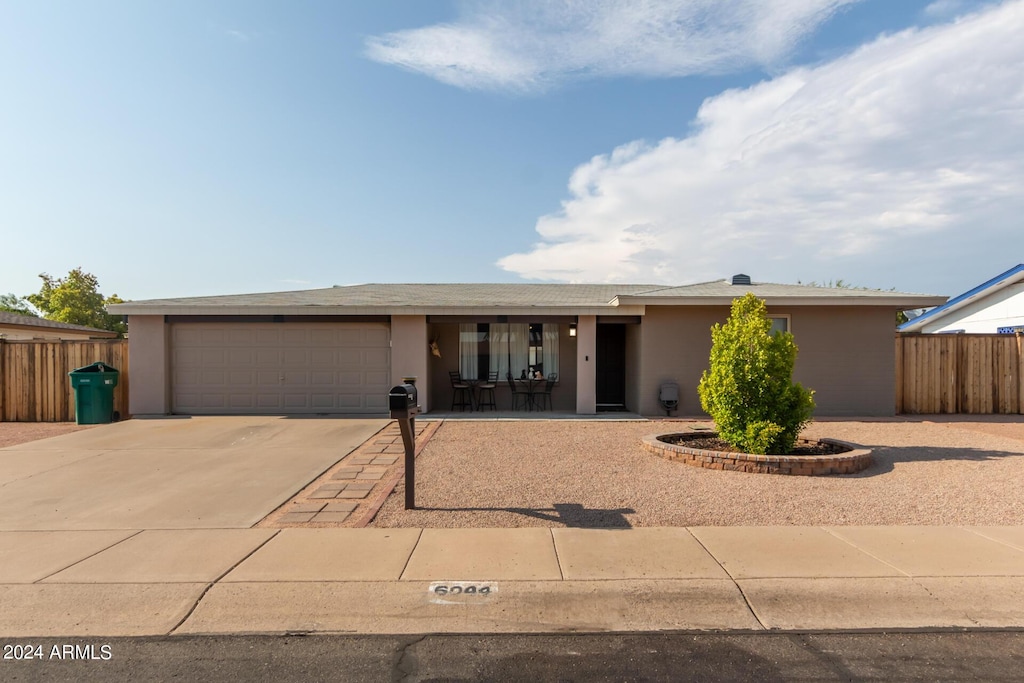 ranch-style home with a garage