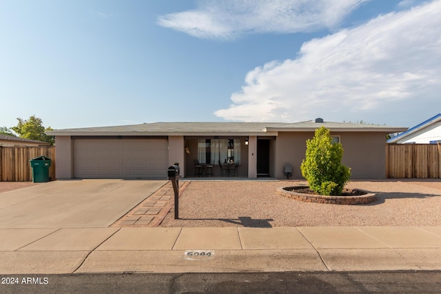 ranch-style home with a garage