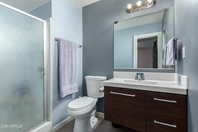 bathroom with toilet, vanity, tile patterned floors, and an enclosed shower