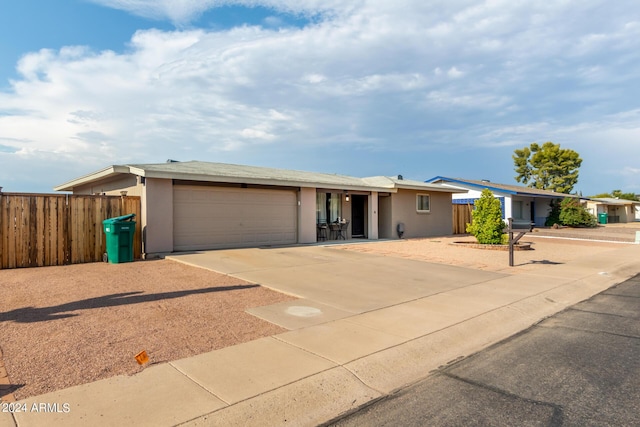 ranch-style home featuring a garage