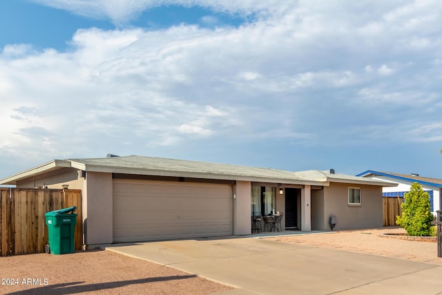 ranch-style home featuring a garage