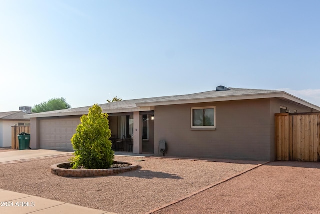 single story home with a garage