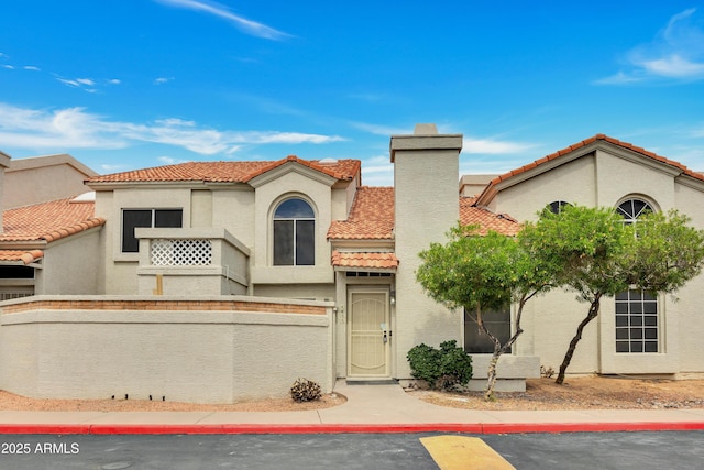 1717 E Union Hills Dr Unit 1033, Phoenix, AZ 85024 - view of front of house with stucco siding, a tile roof, and a chimney