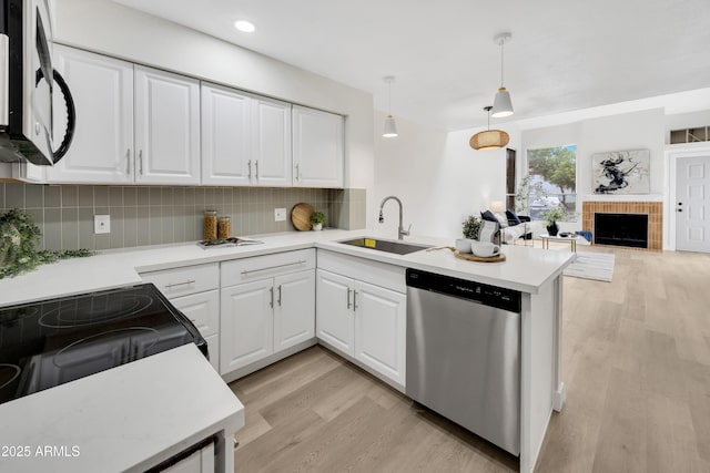 1717 E Union Hills Dr Unit 1033, Phoenix, AZ 85024 - kitchen with dishwasher, a sink, light wood finished floors, decorative backsplash, and light countertops
