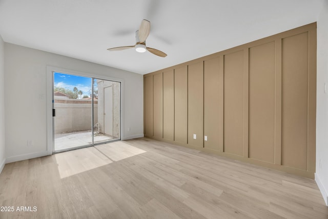 1717 E Union Hills Dr Unit 1033, Phoenix, AZ 85024 - empty room featuring light wood finished floors, a ceiling fan, and baseboards