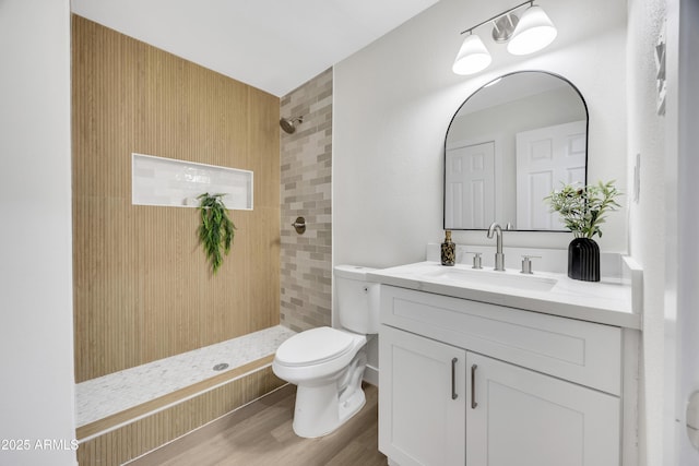 1717 E Union Hills Dr Unit 1033, Phoenix, AZ 85024 - full bathroom with toilet, a tile shower, vanity, and wood finished floors