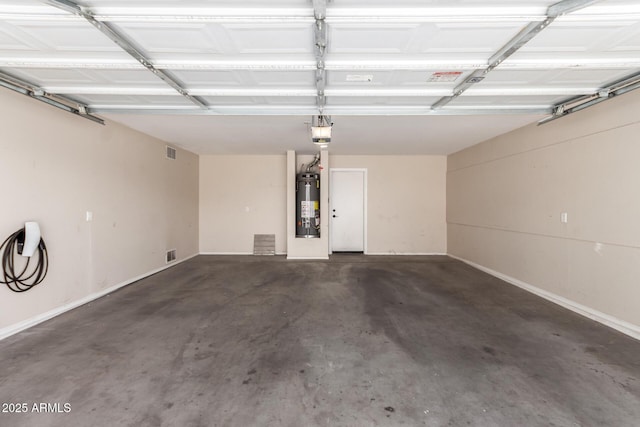 37911 N Luke Ln, San Tan Valley, AZ 85140 - garage with gas water heater, a garage door opener, and baseboards