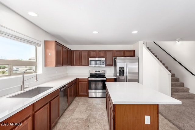 37911 N Luke Ln, San Tan Valley, AZ 85140 - kitchen featuring appliances with stainless steel finishes, a sink, a kitchen island, light countertops, and recessed lighting
