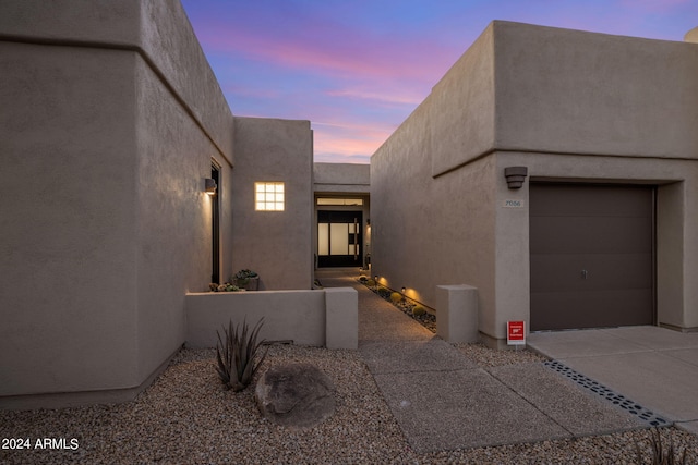 entrance to property featuring driveway