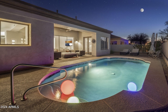 view of pool with an outdoor hangout area, a patio, and ceiling fan