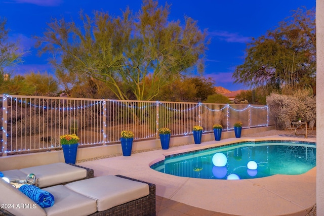 view of pool with fence and a patio