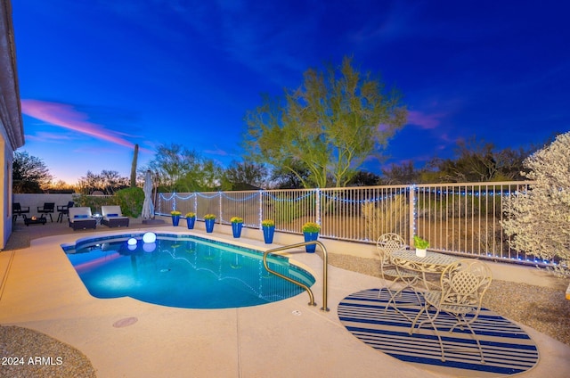 view of swimming pool with a fenced backyard, a patio area, and a fenced in pool