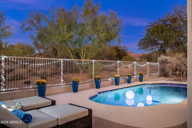 view of pool featuring a fenced in pool, fence, and a patio area