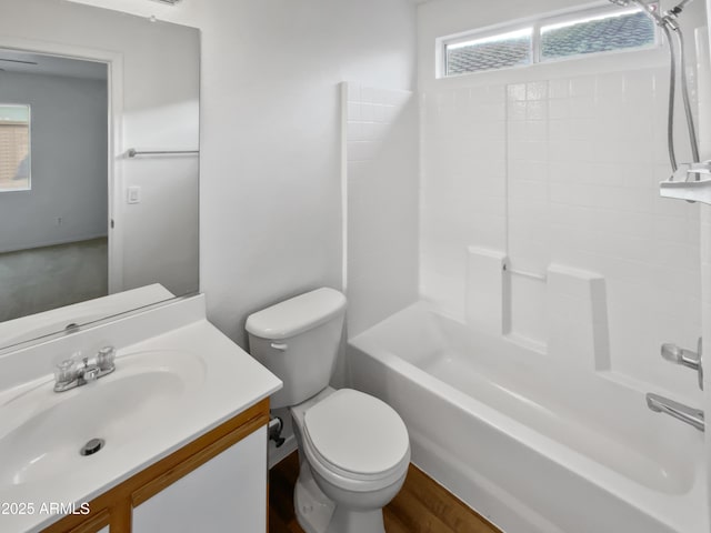 full bathroom with shower / bathing tub combination, vanity, and toilet