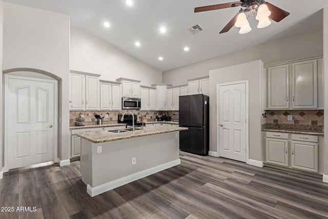 3580 E Kesler Ln, Gilbert, AZ 85295 - kitchen with ceiling fan, tasteful backsplash, a sink, freestanding refrigerator, and stainless steel microwave