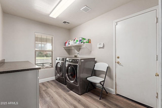 3580 E Kesler Ln, Gilbert, AZ 85295 - laundry area with independent washer and dryer, laundry area, baseboards, and light wood-style flooring