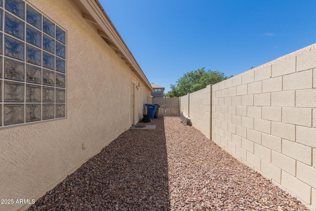 3580 E Kesler Ln, Gilbert, AZ 85295 - view of side of home featuring a fenced backyard and stucco siding