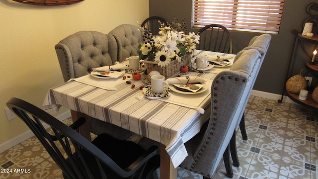 dining area featuring light tile patterned floors