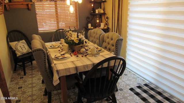 dining area with light tile patterned floors