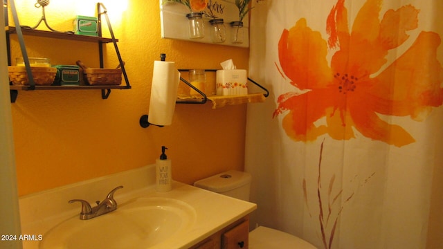 bathroom with vanity and toilet