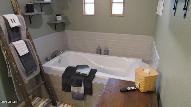 bathroom featuring a relaxing tiled tub