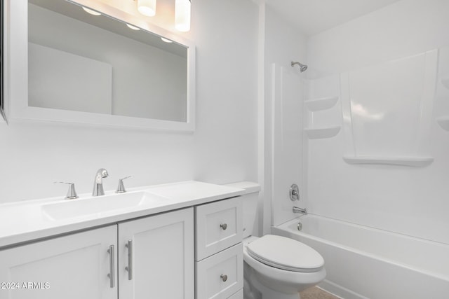 full bathroom featuring shower / bathing tub combination, vanity, and toilet