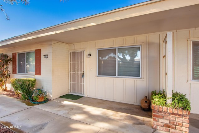 doorway to property with a patio area