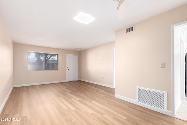 unfurnished room featuring light hardwood / wood-style flooring