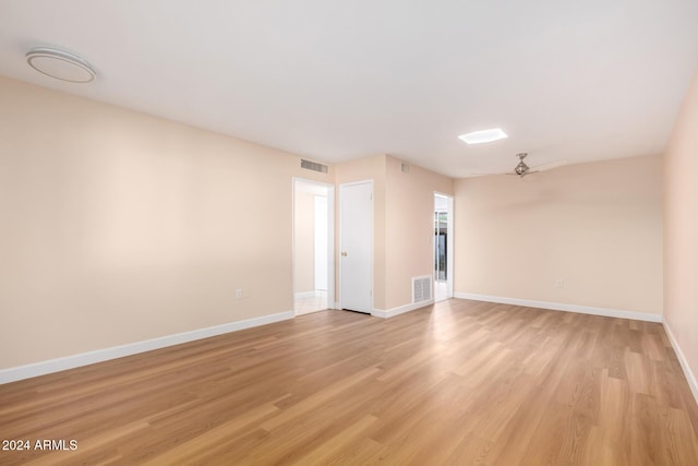 unfurnished room featuring ceiling fan and light wood-type flooring