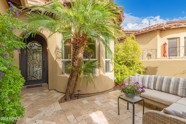 exterior space with an outdoor living space and a patio area