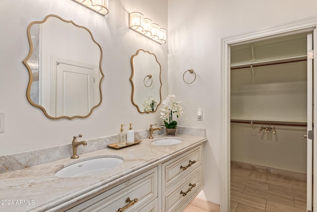 bathroom with vanity and hardwood / wood-style flooring