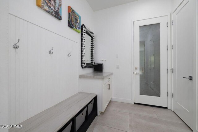 mudroom featuring light tile patterned flooring