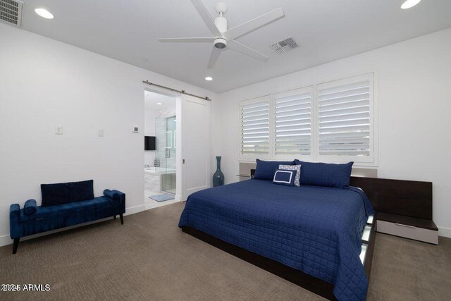 bedroom with recessed lighting, carpet flooring, a barn door, and visible vents