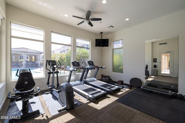 exercise room featuring baseboards, visible vents, ceiling fan, and recessed lighting