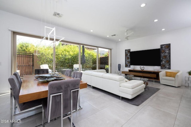 living room featuring visible vents, a wealth of natural light, and recessed lighting