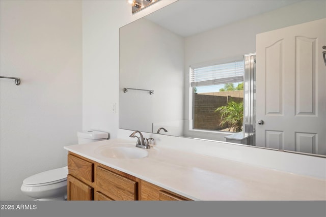 bathroom with vanity and toilet