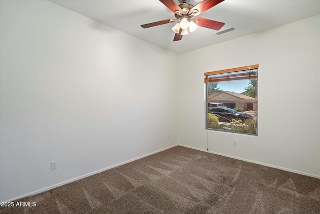 carpeted empty room featuring visible vents, baseboards, and ceiling fan