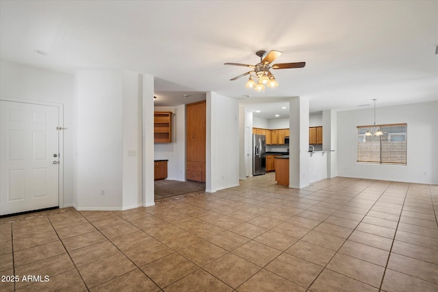 unfurnished living room with recessed lighting, a ceiling fan, baseboards, and light tile patterned floors