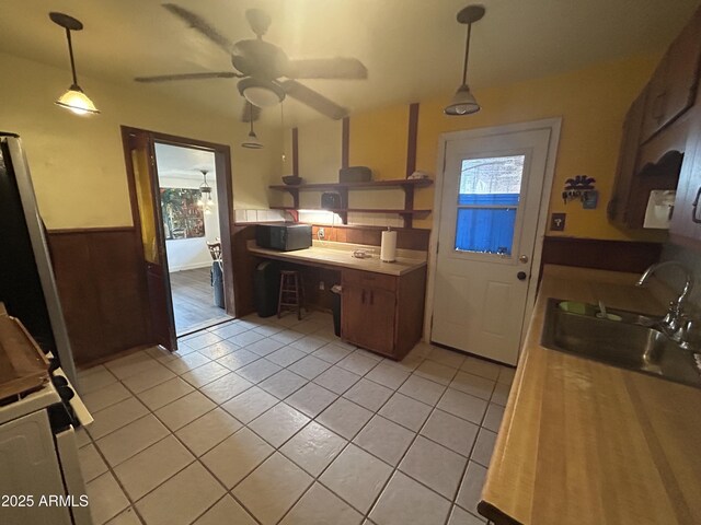 3021 E Saint John Rd, Phoenix, AZ 85032 - kitchen with a ceiling fan, a sink, wainscoting, light tile patterned floors, and decorative light fixtures
