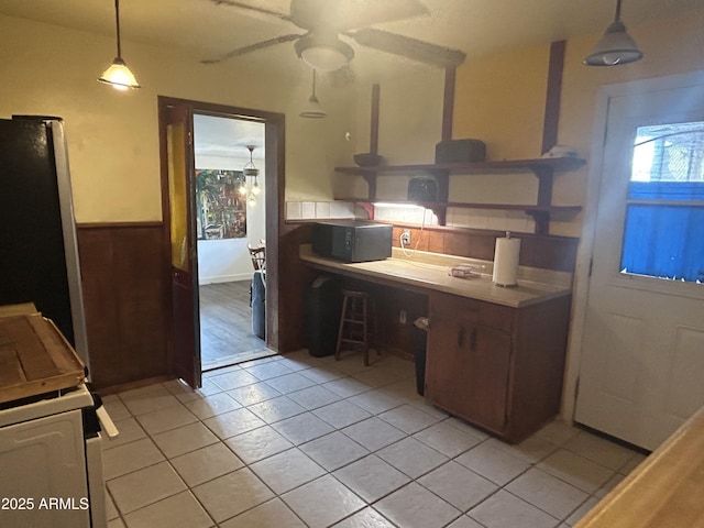 3021 E Saint John Rd, Phoenix, AZ 85032 - kitchen featuring hanging light fixtures, white stove, light tile patterned floors, ceiling fan, and freestanding refrigerator