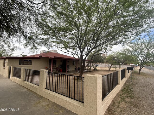 3021 E Saint John Rd, Phoenix, AZ 85032 - exterior space featuring stucco siding and a fenced front yard