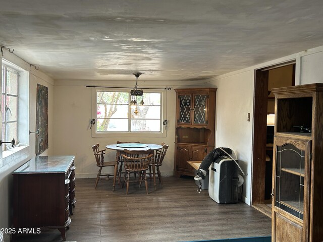 3021 E Saint John Rd, Phoenix, AZ 85032 - dining space with baseboards and dark wood-type flooring