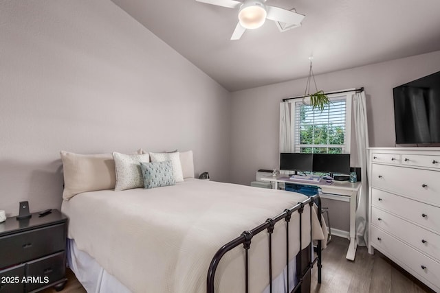 1600 N Saba St Unit 143, Chandler, AZ 85225 - bedroom featuring wood finished floors, lofted ceiling, and a ceiling fan