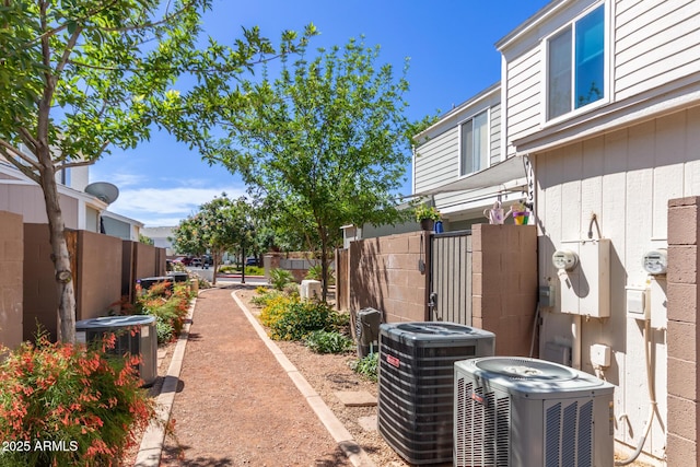 1600 N Saba St Unit 143, Chandler, AZ 85225 - view of yard with central AC unit and fence