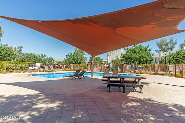 1600 N Saba St Unit 143, Chandler, AZ 85225 - view of patio with a community pool and fence