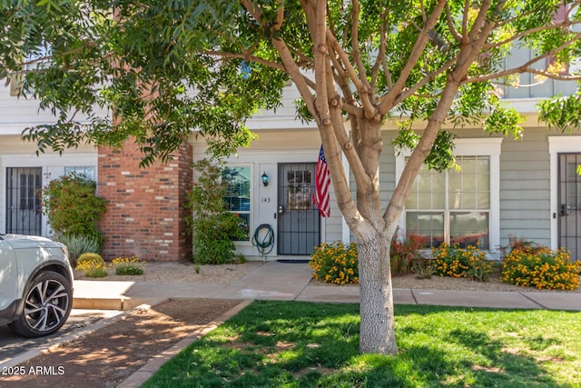 1600 N Saba St Unit 143, Chandler, AZ 85225 - view of front of home with brick siding