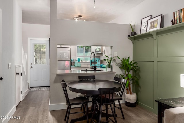 1600 N Saba St Unit 143, Chandler, AZ 85225 - dining space with wood finished floors and baseboards