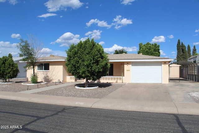 235 N 61st Pl, Mesa, AZ 85205 - view of front of property featuring driveway, an attached garage, a gate, and stucco siding