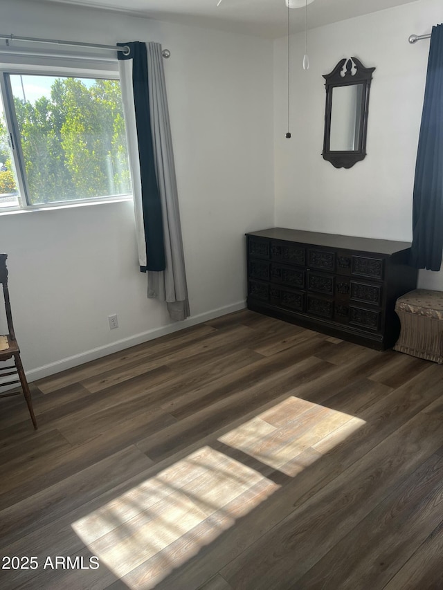 235 N 61st Pl, Mesa, AZ 85205 - unfurnished bedroom featuring wood finished floors and baseboards